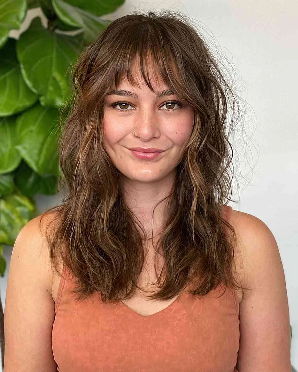 Shaggy shoulder length layers for thin fine hair with soft bangs and texture