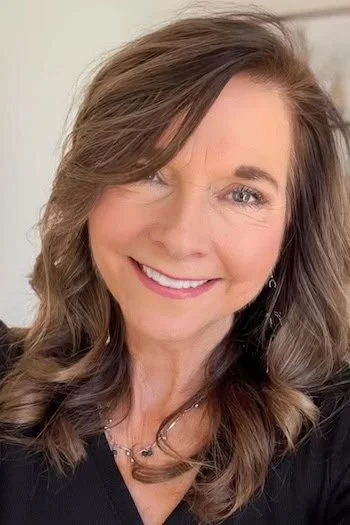 Side-swept shoulder length layers for thin fine hair with warm brunette movement