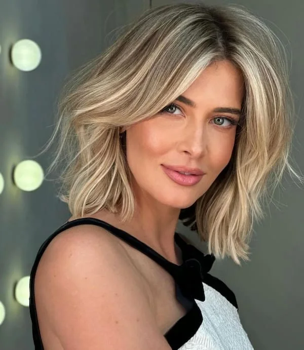Smooth blonde angled shoulder length lob for thin fine hair with side volume