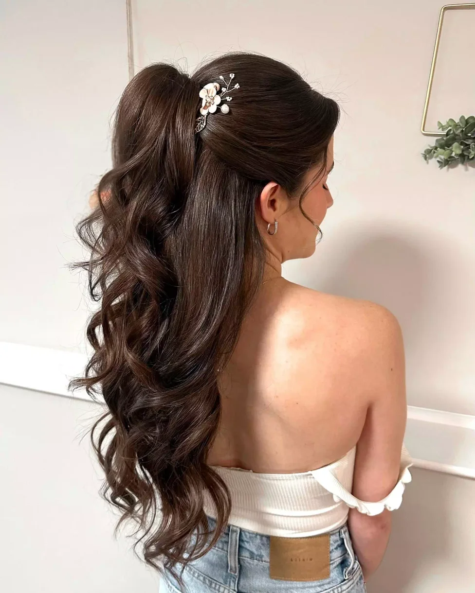chest wavy brunette layers shown as a simple wedding guest hair idea