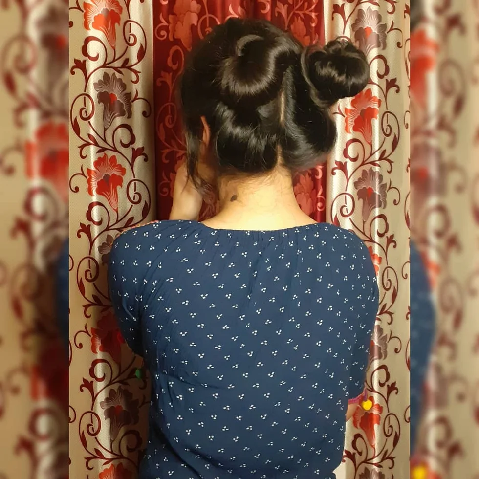 neck straight black bun shown as a space buns idea