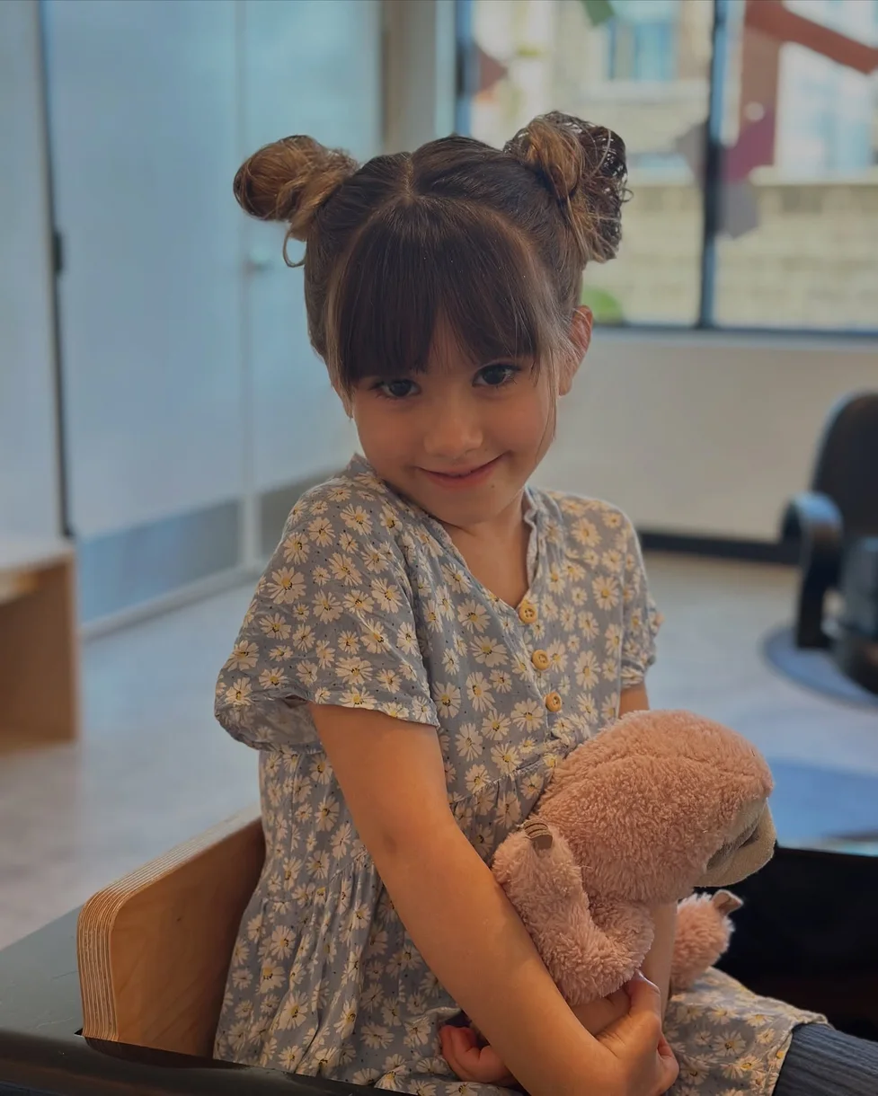 neck straight brunette bun shown as a space buns idea
