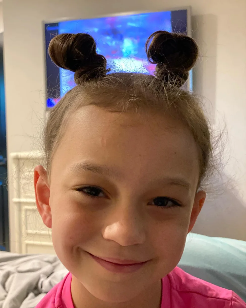 shoulder straight brunette bun shown as a space buns idea, featuring brunette color