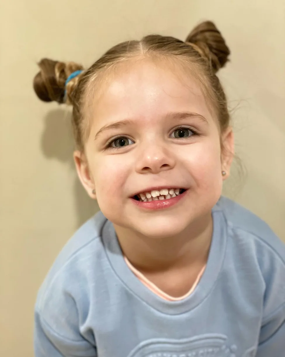 shoulder straight brunette bun shown as a space buns idea, featuring shoulder outline