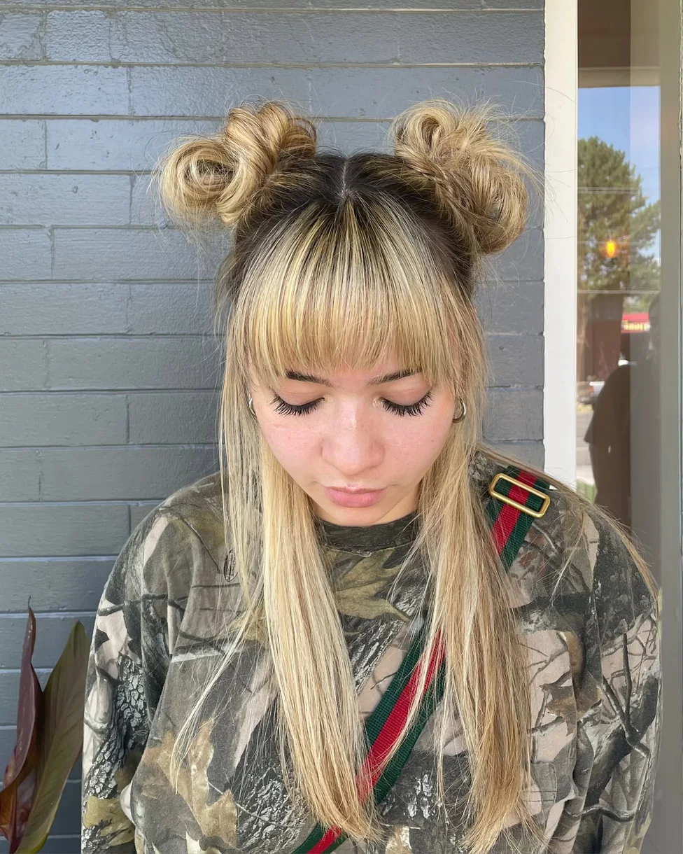 chest straight blonde bun with blunt fringe shown as a space buns idea