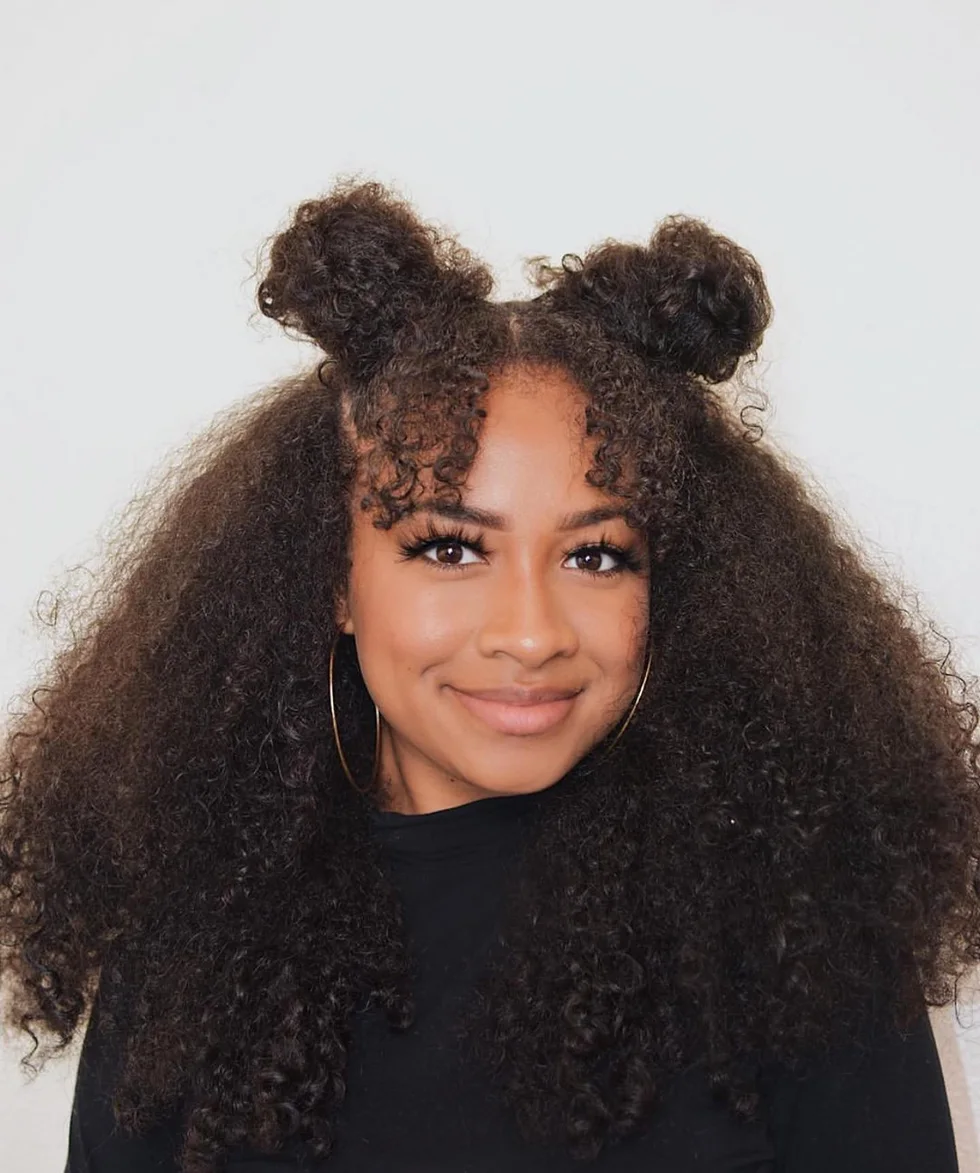 shoulder coily black bun shown as a space buns idea