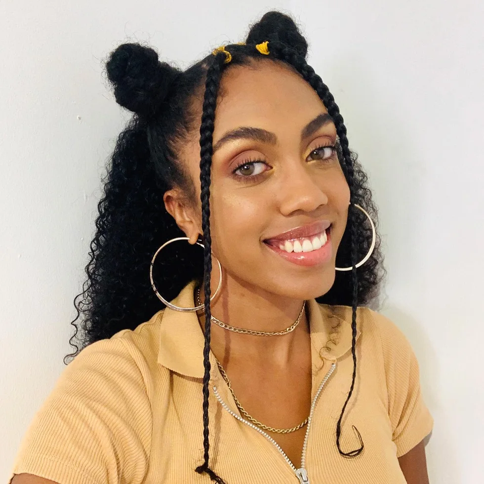 ear coily black box braids shown as a space buns idea