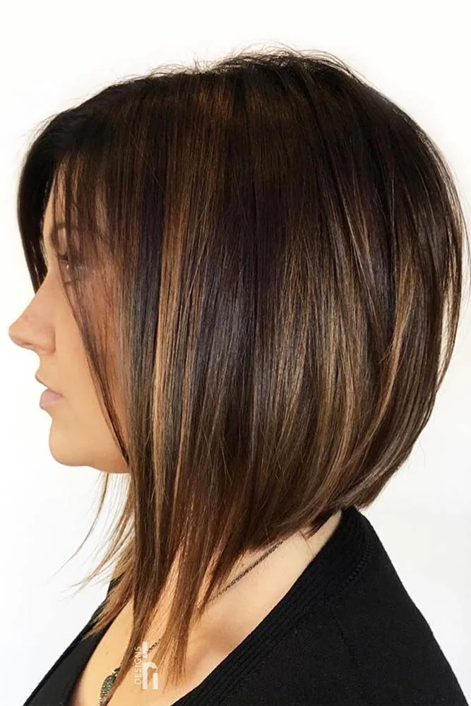 Side view of a smooth brown bob with a compact rounded back and long front points
