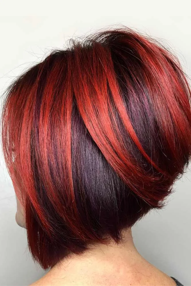 Back-side view of a dark bob with red ribbons and a rounded short back