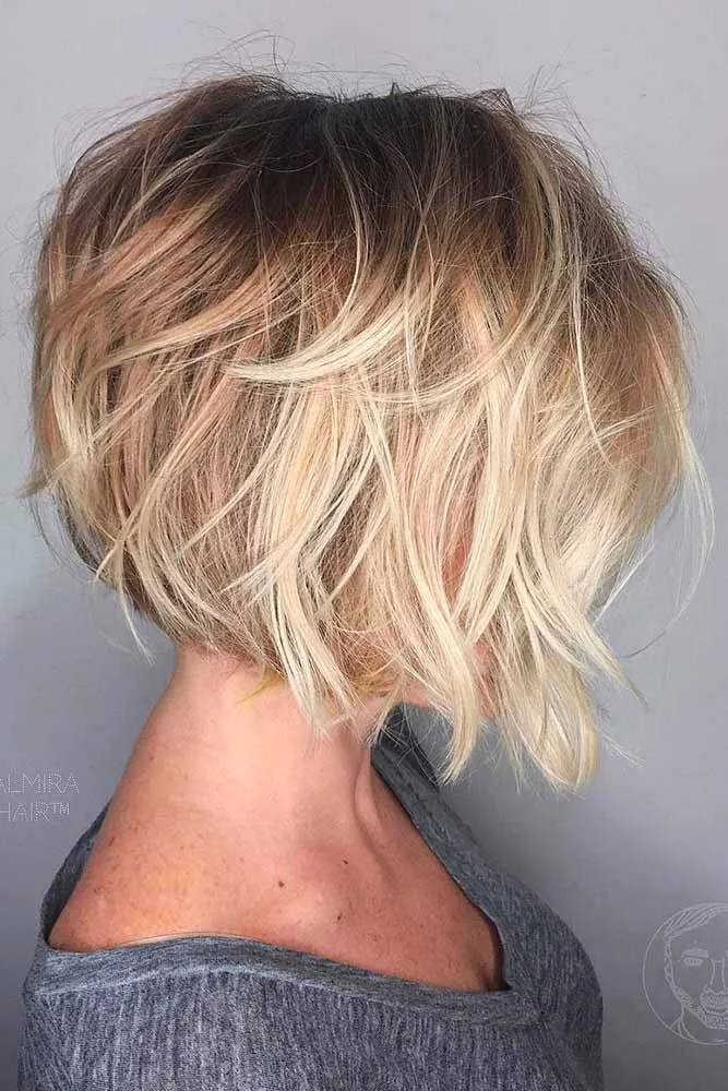 Side-back view of a blonde bob with separated waves and a closely tapered nape