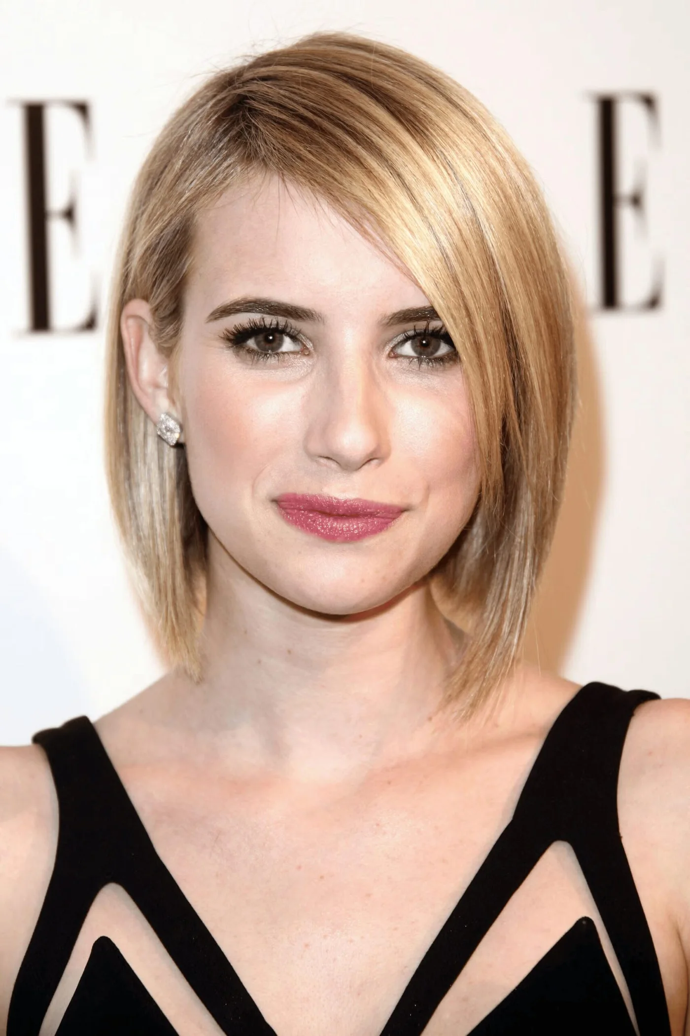 chin straight golden bob with side swept fringe shown as a thin hair bob idea