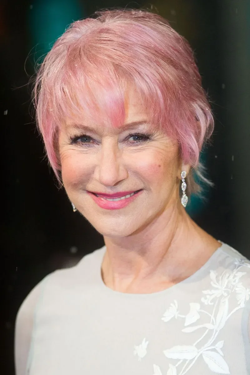 ear straight pink pixie with wispy fringe shown as a thin hairstyles for older women idea