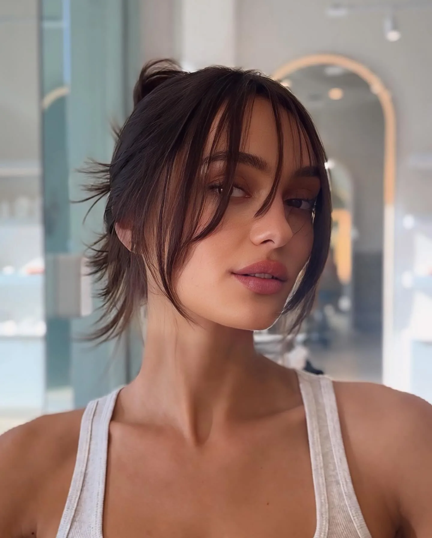soft face-framing pinned updo with brunette straight hair styled as an updo for fine thin hair