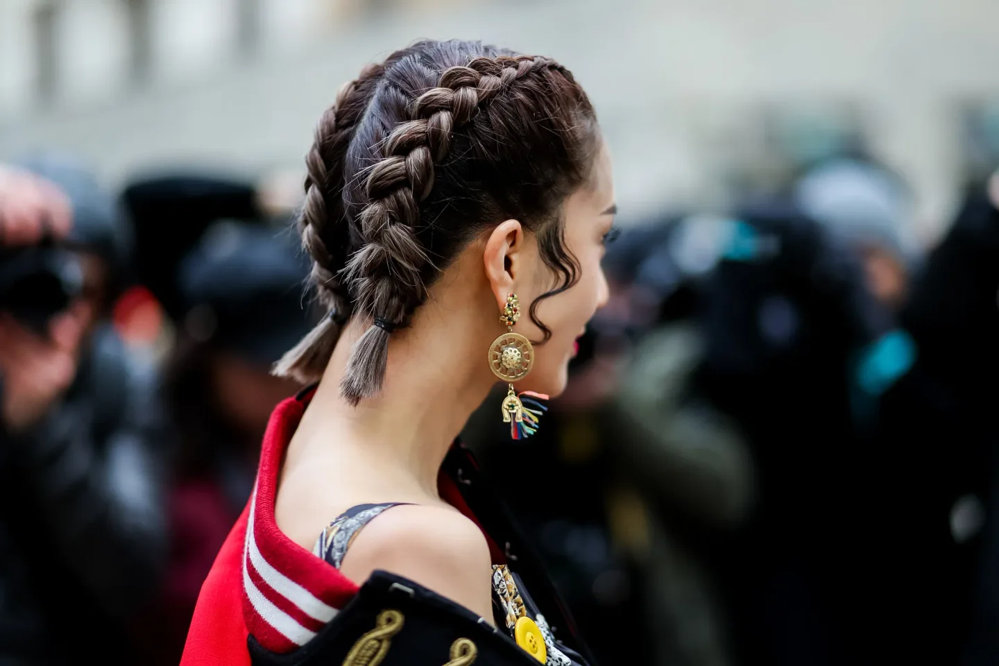 braided low updo with loose curl with brunette braids hair styled as an updo for fine thin hair