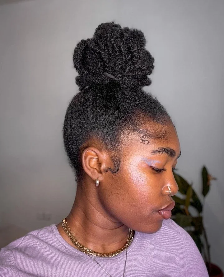 tall textured puff updo with black coily hair styled as an updo for fine thin hair