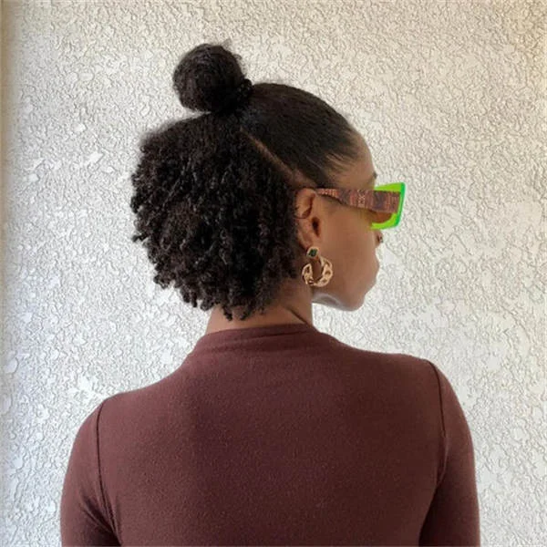 low puff bun with glasses with black coily hair styled as an updo for fine thin hair