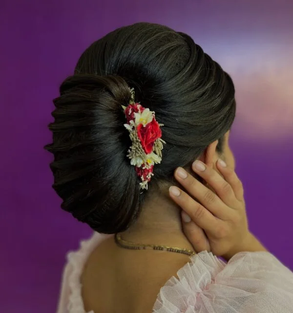 floral sleek low bun with black straight hair styled as an updo for fine thin hair
