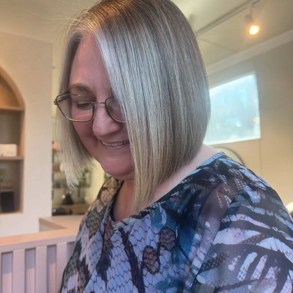 straight silver chin bob on a woman over 60 with an easy wash-and-wear haircut shape