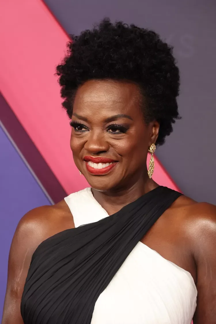 natural coily tapered crop on a woman over 60 with an easy wash-and-wear haircut shape