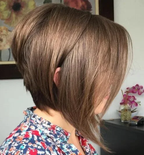 short layered bob back view on a woman over 60 with an easy wash-and-wear haircut shape