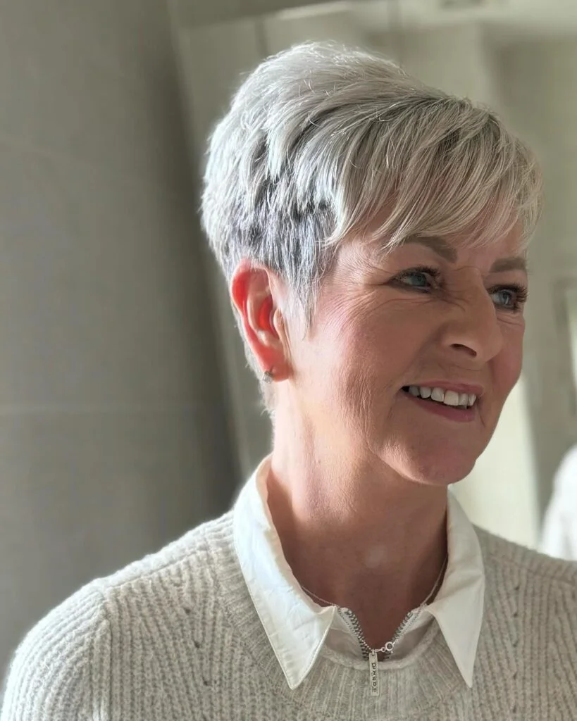 silver tapered pixie on a woman over 60 with an easy wash-and-wear haircut shape