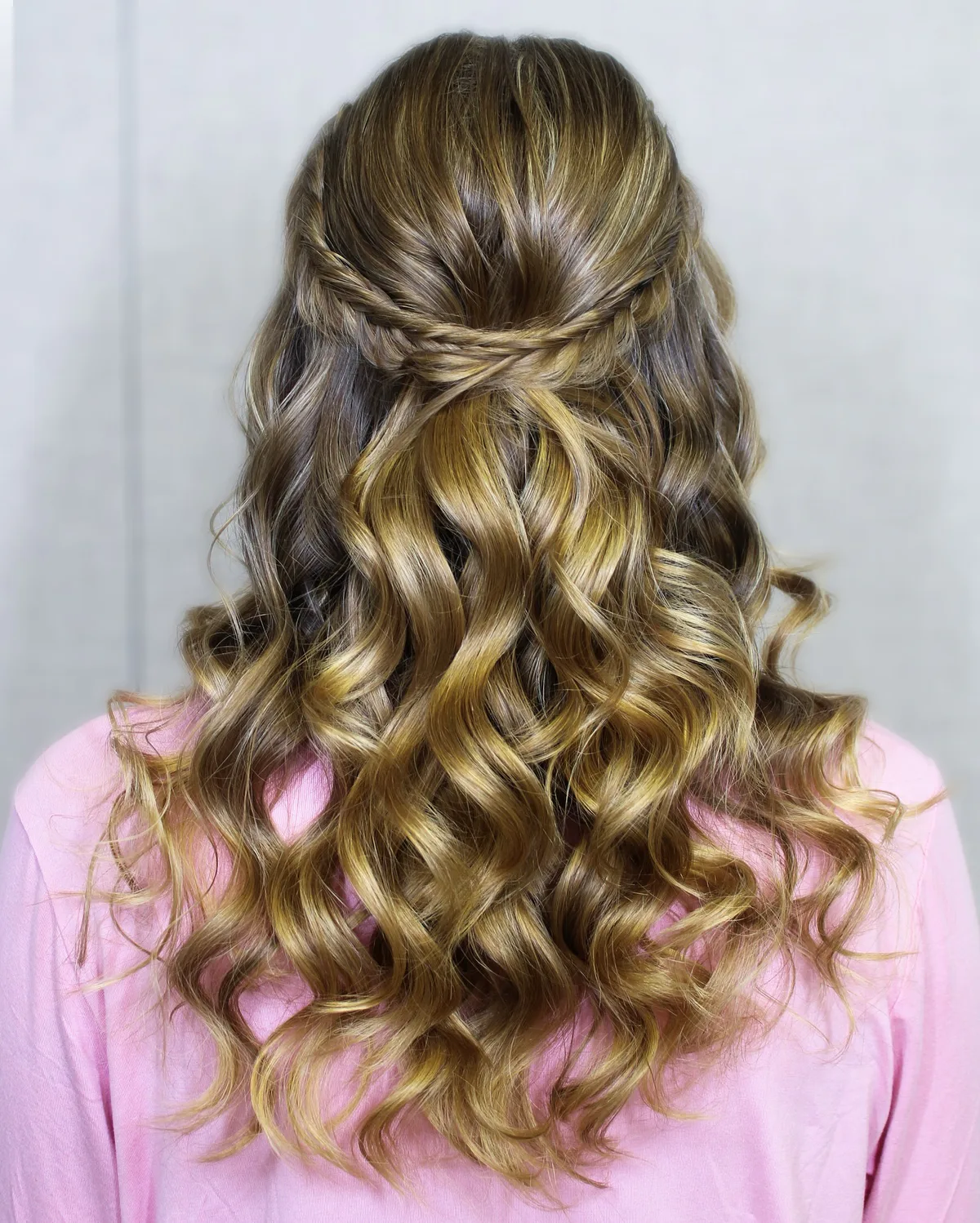 chest wavy blonde half up shown as a waterfall hairstyles idea