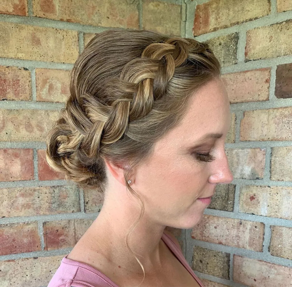 chest wavy brunette updo shown as a wedding hairstyles ideas for long hair idea