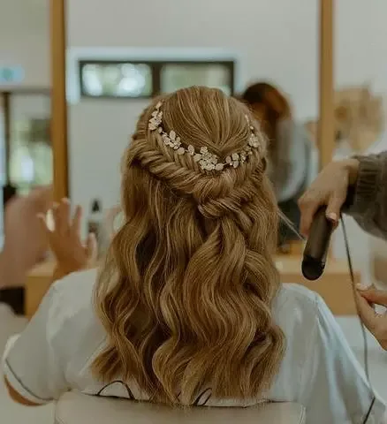 chest wavy blonde ponytail shown as a wedding hairstyles ideas for long hair idea