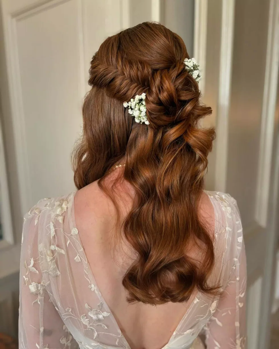 chest wavy brunette ponytail shown as a wedding hairstyles ideas for long hair idea, featuring brunette color